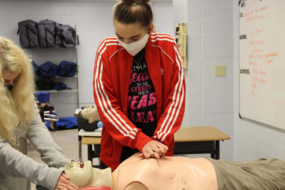 A MOVTI student learns to do CPR